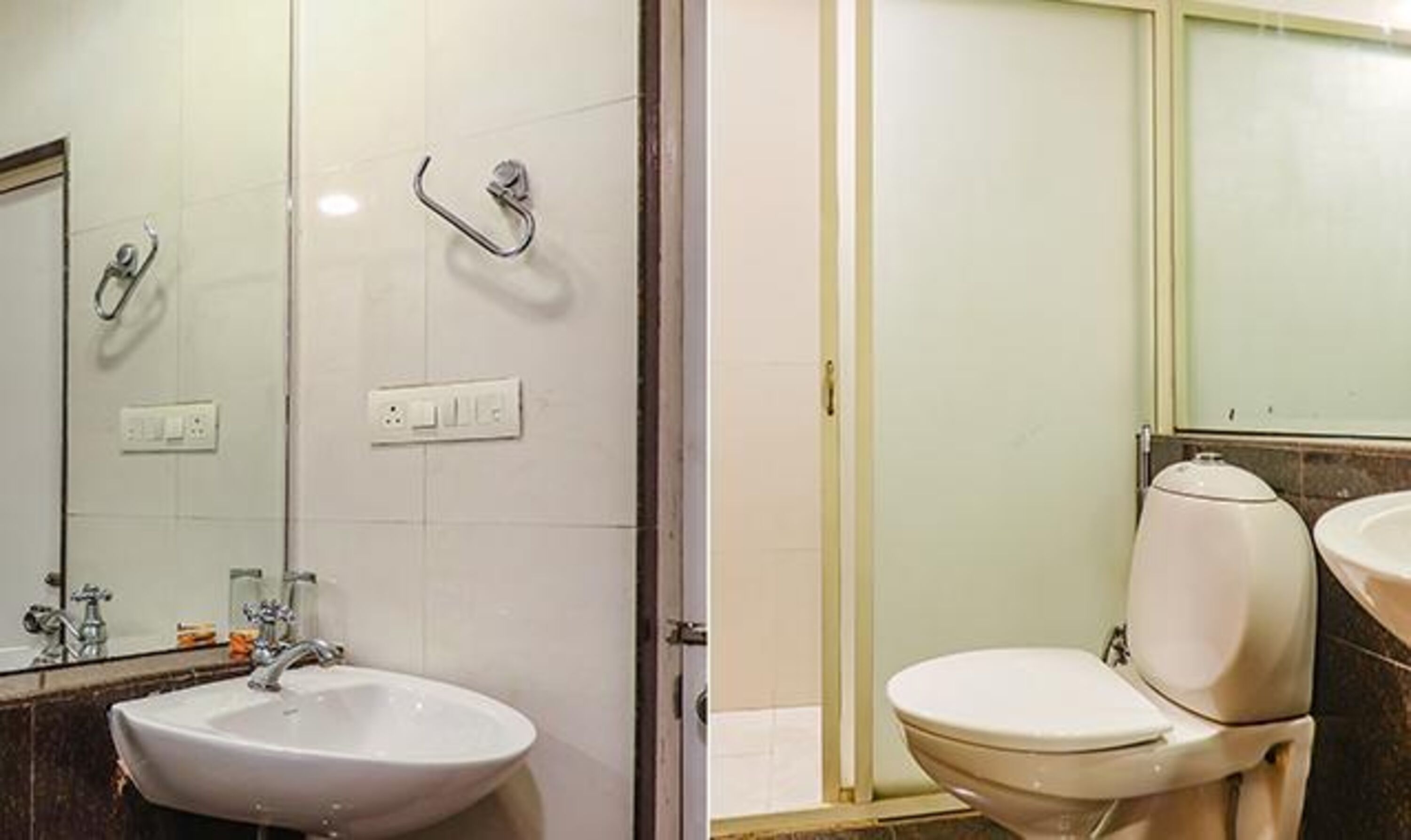 Kylpyhuone, jossa on pesuallas, peili ja wc.