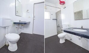 A bathroom with a toilet, sink, and mirror.