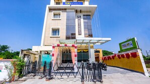 A hotel with a modern design, a sign for 'Tab Hotels', and a 'K's Heights' sign. - Fabhotel Mng (Kanpur)