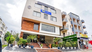 A modern hotel with a sign for 'Tab Hotels' and 'Hotel Ocean Breeze'. - Fabhotel Prime Ocean Breeze (Bhopal)