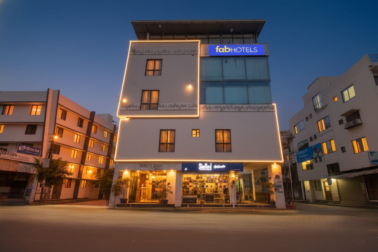 A multi-story building with a sign for 'fabHOTELS' at the top.