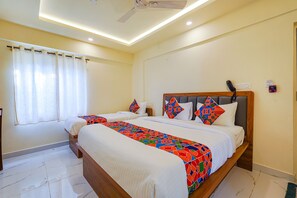 Egyptian cotton sheets, premium bedding, in-room safe, soundproofing - FabHotel Happy Home Stay (Bengaluru)
