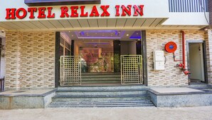 A hotel entrance with a sign reading "HOTEL RELAX INN". - Fabhotel Relax Inn I (Kanpur)