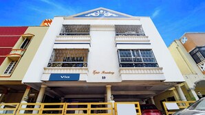 A building with a sign reading 'Epic Residency 59' and a 'Via' sign below it. - Via Epic Residency (Chennai)