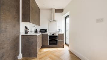 Two Bedroom Apartment - Balcony | Private kitchen | Full-size fridge, microwave, oven, stovetop