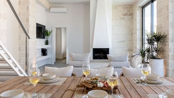 Deluxe Villa, Sea View | Living area | 55-inch Smart TV with satellite channels, fireplace