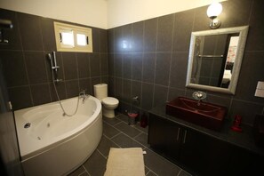 Jetted tub, hair dryer, towels, soap
