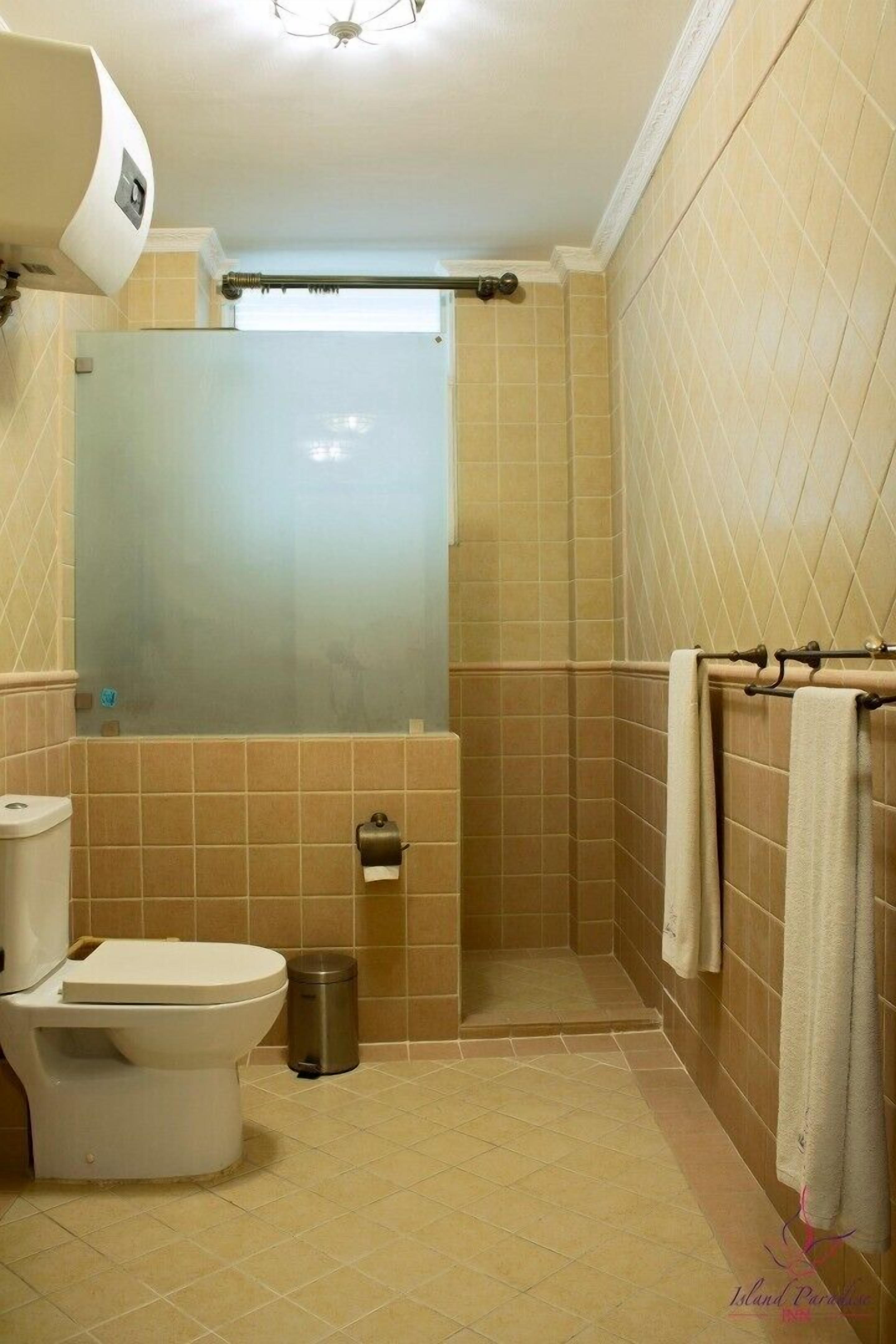 deluxe twin | bathroom | shower, hair dryer, slippers, bidet