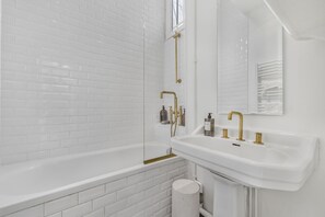 Bathtub, hair dryer, towels