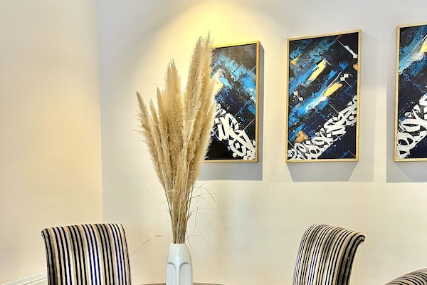 Elite Apartment | Living area | 45-inch LED TV with cable channels, Netflix, Hulu