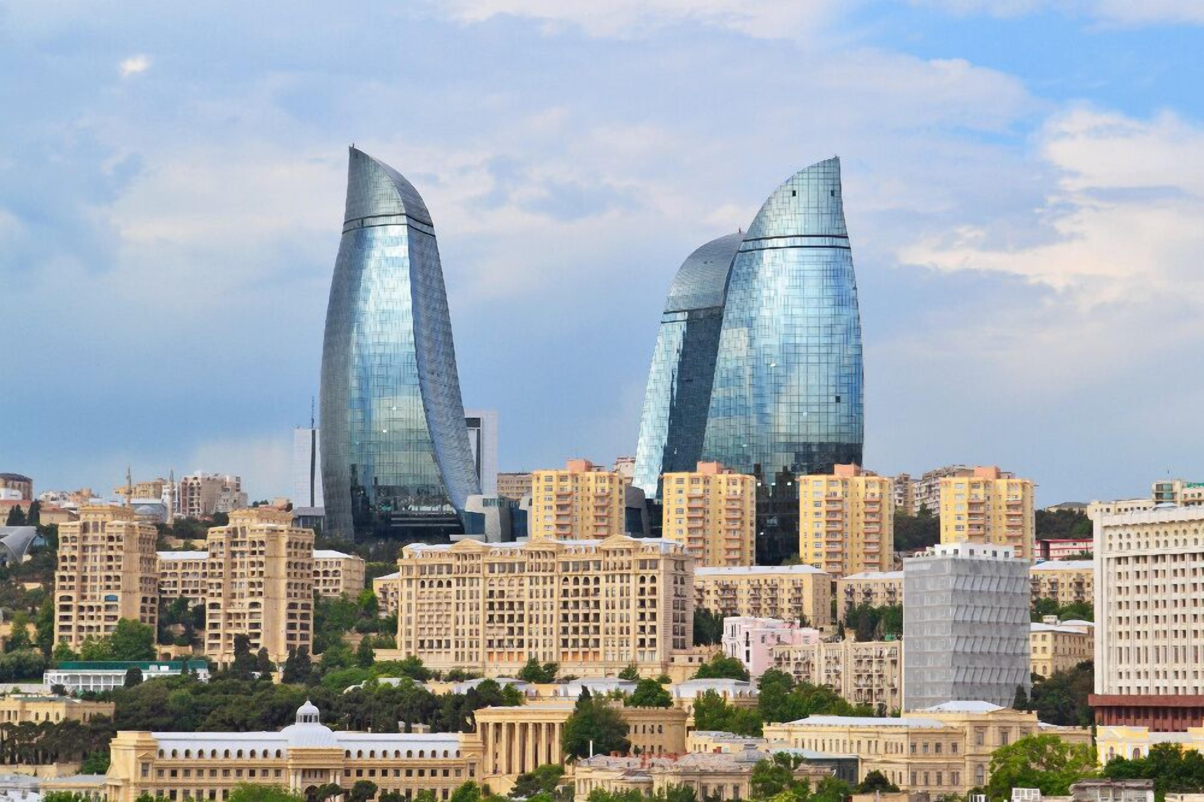 A cityscape with modern skyscrapers and traditional buildings.