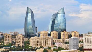 A cityscape with modern skyscrapers and traditional buildings.