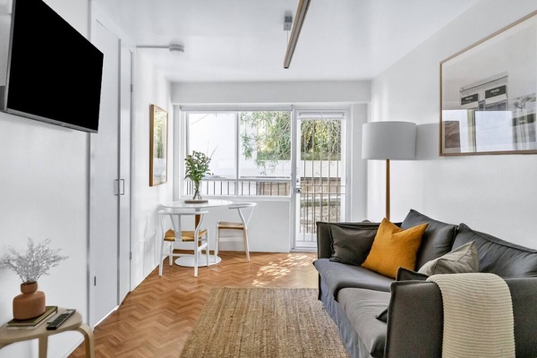 Thoughtful pieces of decor and hanging art make this space truly special. Put your feet up on the large couch and enjoy Netflix on the wall-mounted HD TV.