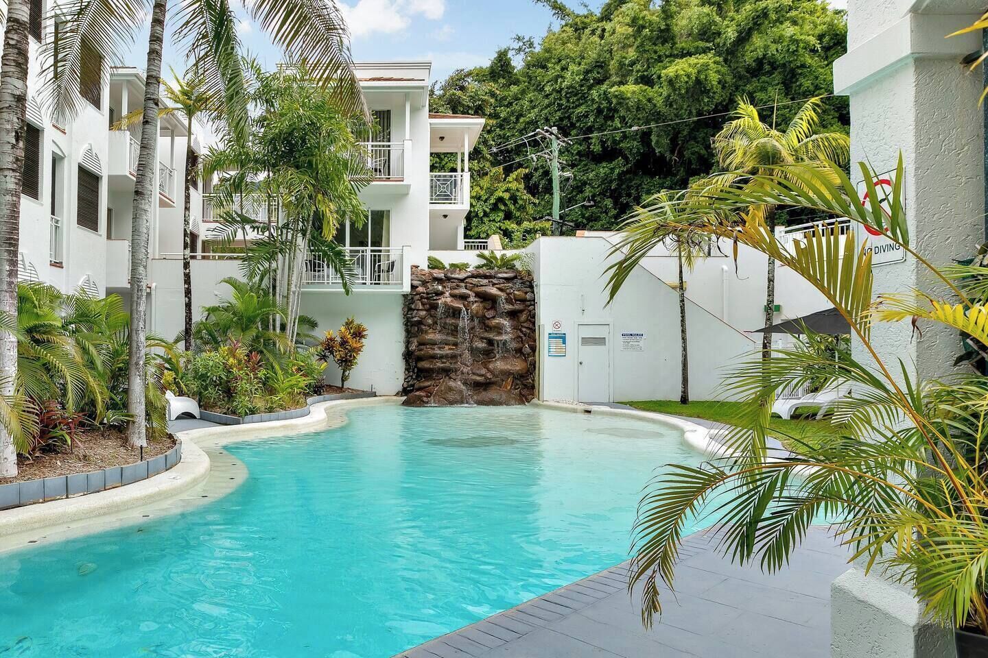 Cool off with a dip in the waterfall swimming pool or unwind on the daybeds with a book.
