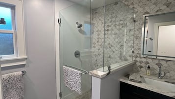 Shower, hair dryer, towels, soap