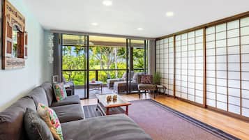 Condo, 2 Queen Beds, Balcony, Partial Ocean View (Grace's Oasis) | Living area | 50-inch flat-screen TV with digital channels