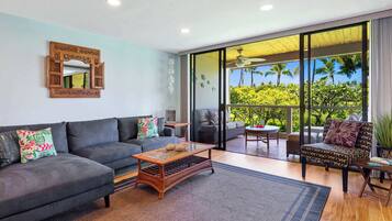 Condo, 2 Queen Beds, Balcony, Partial Ocean View (Grace's Oasis) | Living area | 50-inch flat-screen TV with digital channels