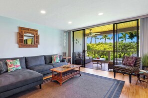 Condo, 2 Queen Beds, Balcony, Partial Ocean View (Grace's Oasis) | Living area | 50-inch flat-screen TV with digital channels