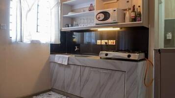 Fridge, microwave, electric kettle, cookware/dishes/utensils