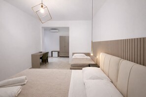 Comfort Quadruple Room | Premium bedding, in-room safe, desk, laptop workspace - Vomerooms (Naples)