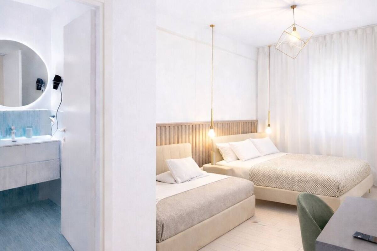 Comfort Quadruple Room | Premium bedding, in-room safe, desk, laptop workspace