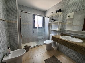 Shower, hair dryer, towels, soap