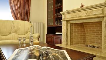 Comfort Apartment | Living area | 40-inch LCD TV with cable channels, fireplace