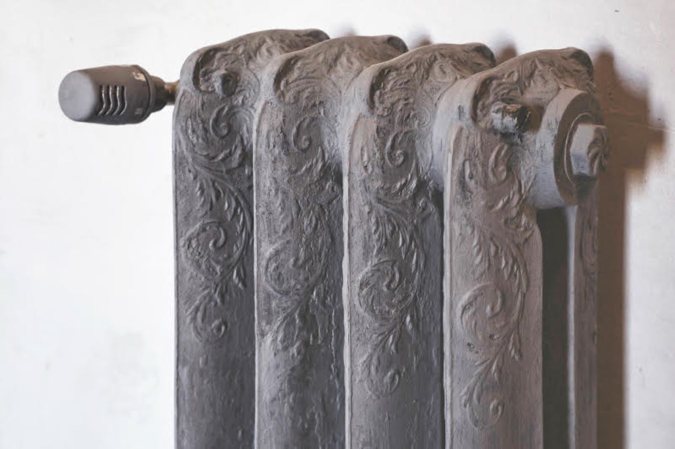 A radiator with intricate scrollwork design.