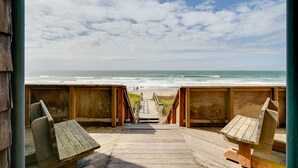 A wooden boardwalk leading to a beach with a clear view of the ocean. - Oceanfront Watsonville Condo w/ Beach Access! (Watsonville)