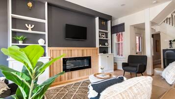 TV, fireplace, books