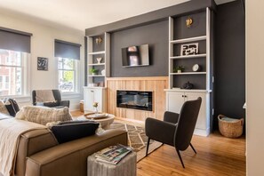 TV, fireplace, books