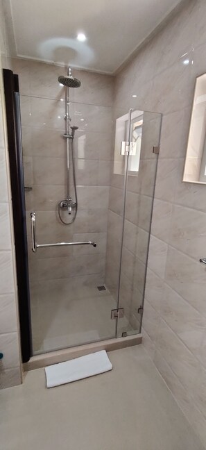 Shower, hair dryer, towels, soap