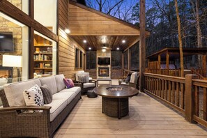 Terrace/patio - Unbridled Manor is an astoundingly beautiful ultra-luxury cabin with pool table. (Broken Bow)