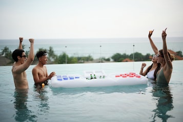 Outdoor pool, open 7:00 AM to 7:00 PM, pool umbrellas, sun loungers