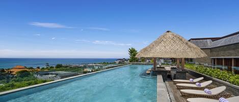 Outdoor pool, open 7:00 AM to 7:00 PM, pool umbrellas, sun loungers