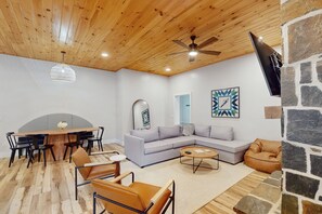 TV, fireplace - Stunning dog-friendly cottage with riverfront patio, hot tub, fire pit, & views (Boone)