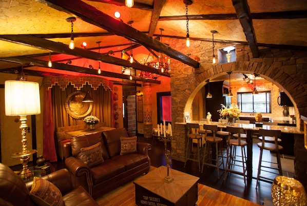 The Archaeologist's Digs | Living area | 45-inch flat-screen TV with cable channels, Netflix, DVD player - The Roxbury (Roxbury)