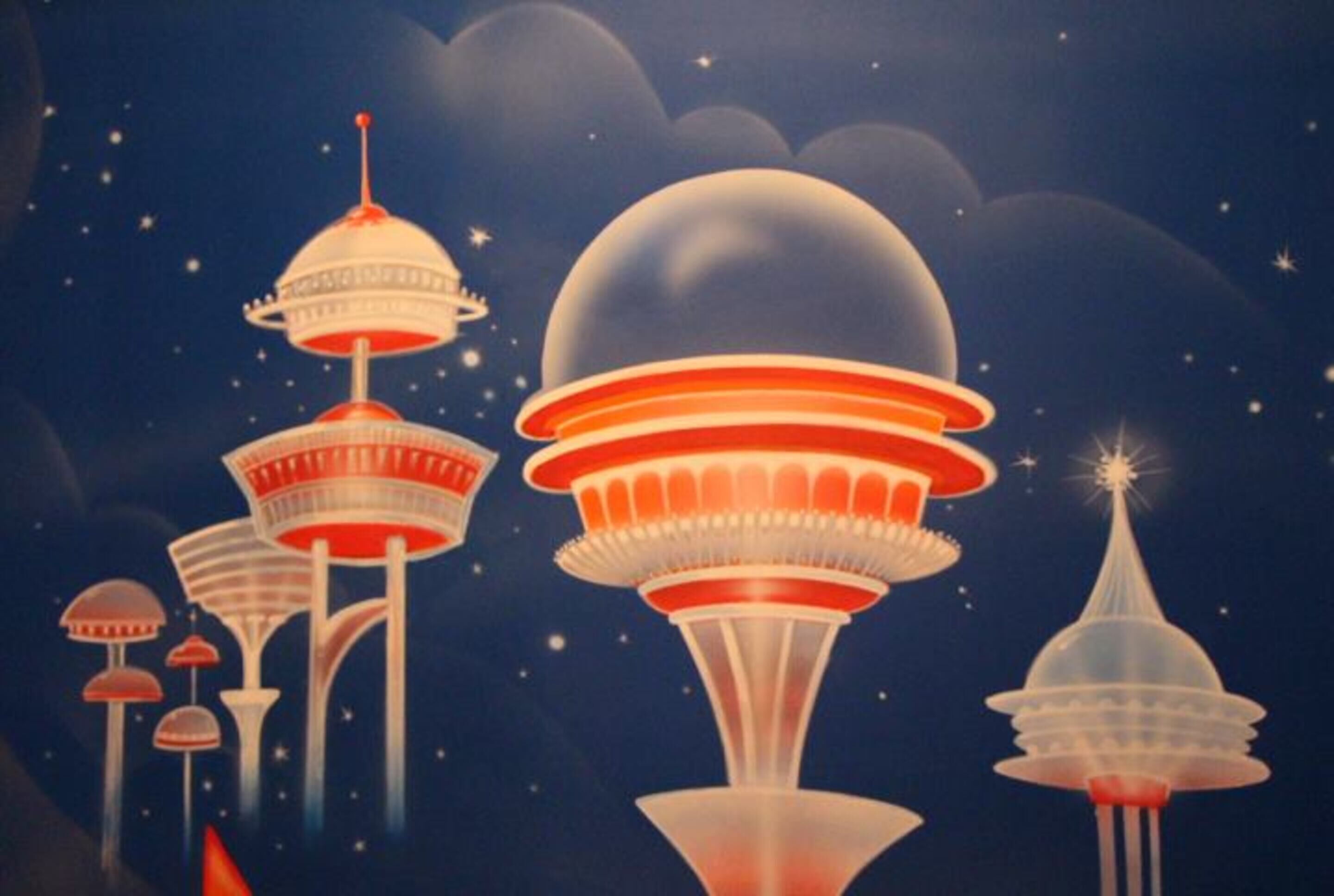 A stylized illustration of futuristic, multi-tiered structures with a night sky background.