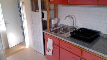 Fridge, electric kettle, cookware/dishes/utensils