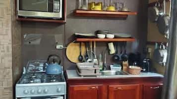 Fridge, microwave, toaster, cookware/dishes/utensils