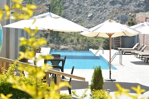 2 outdoor pools, pool umbrellas, pool loungers