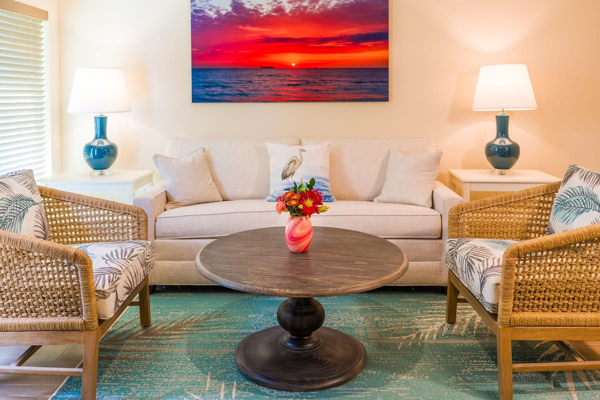 Room 505 - One bedroom suite | Living room | 65-inch flat-screen TV with digital channels