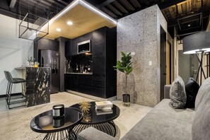 Stylish Apartment with a Private Balcony | Living area | 55-inch Smart TV with digital channels