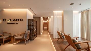 Relax in our elegantly designed lobby, featuring a spacious seating area and access to the spa.