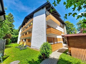 A multi-story building with a white facade, wooden balconies, and a sign reading 'Haus Birkenhain.' - Am Birkenhain by Interhome (Seefeld in Tirol)