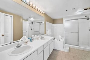 Shower, hair dryer, towels, shampoo