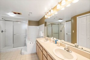 Shower, hair dryer, towels, shampoo