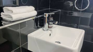 Hair dryer, towels, soap, toilet paper