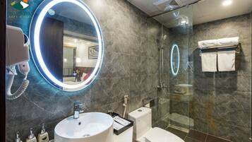 Separate tub and shower, rainfall showerhead, designer toiletries