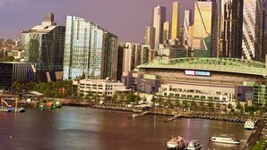 A city skyline with modern buildings and a stadium. - Ensuite Double Room with Private Bathroom and River View (Docklands)